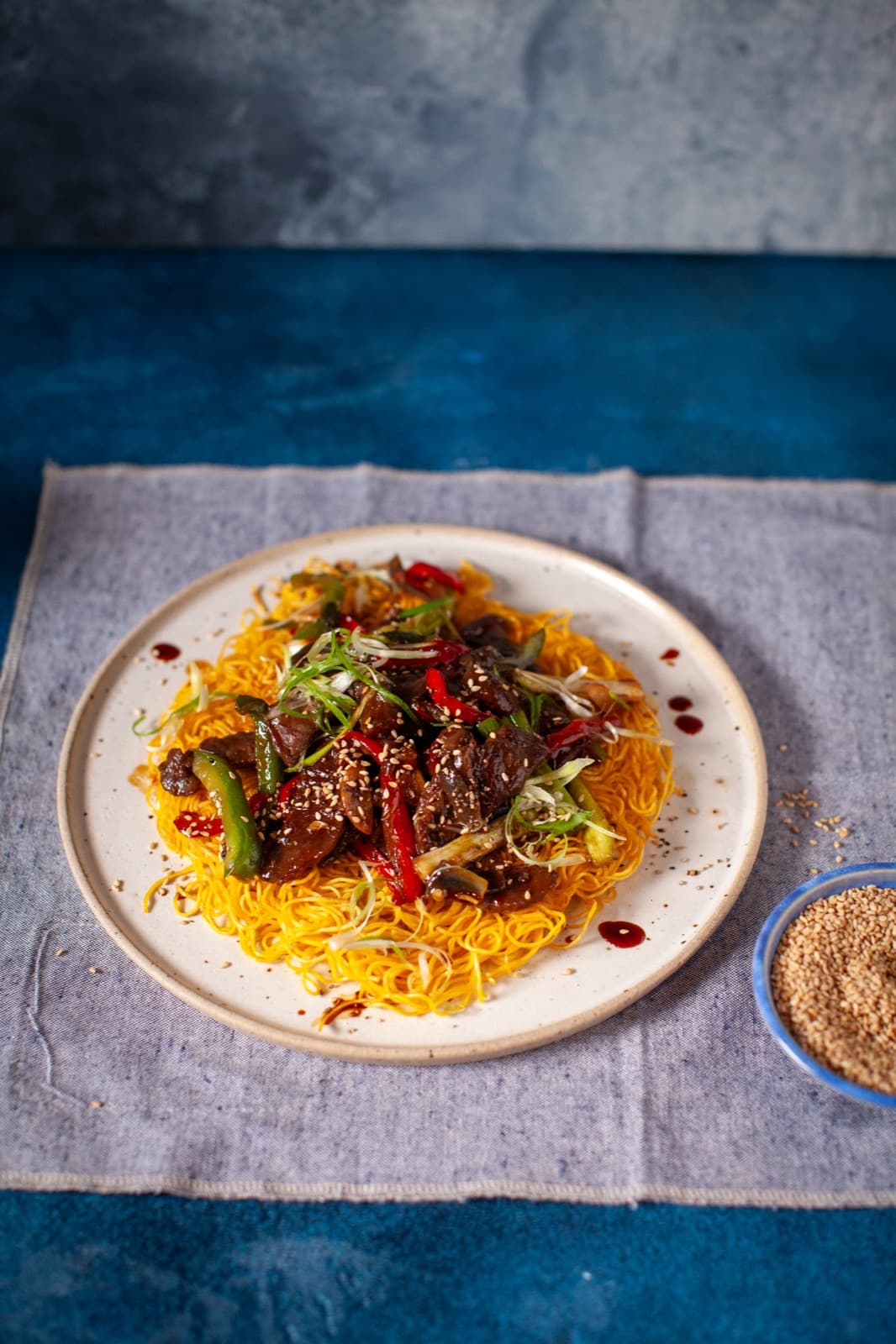 Black Pepper Beef with Crispy Egg Noodle Pancake
