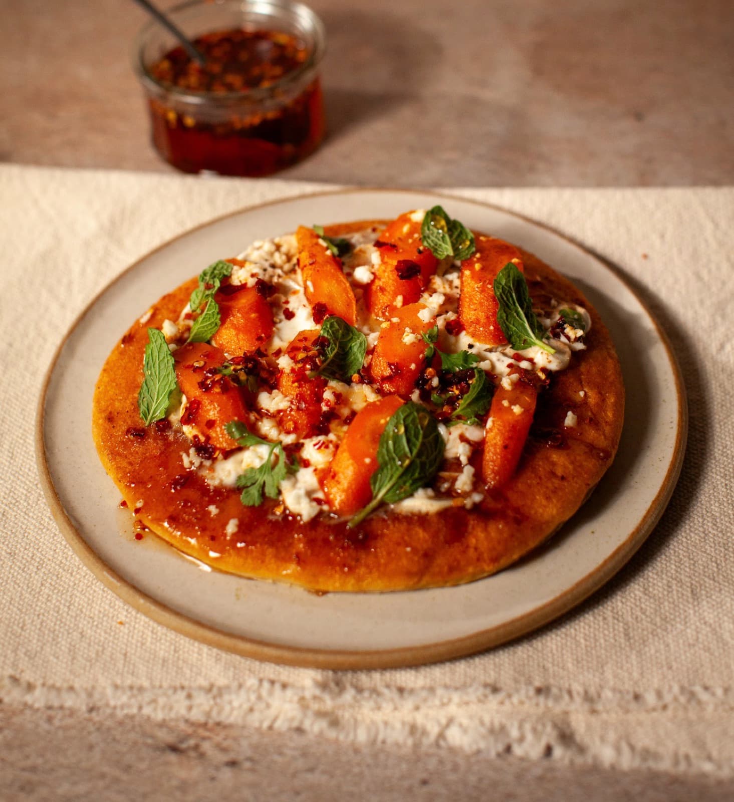 Roasted carrot flatbreads with spiced butter, hot honey and feta
