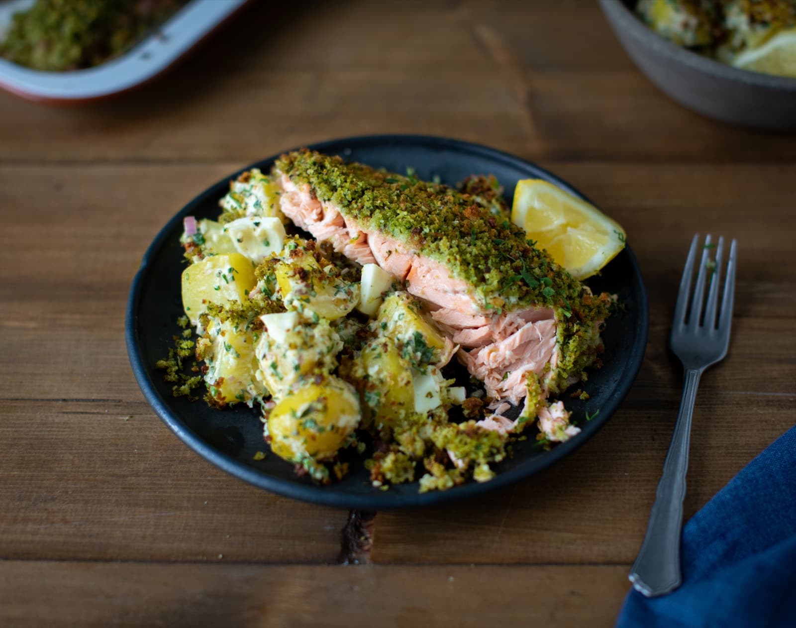 Sourdough crusted salmon with chopped egg and potato salad