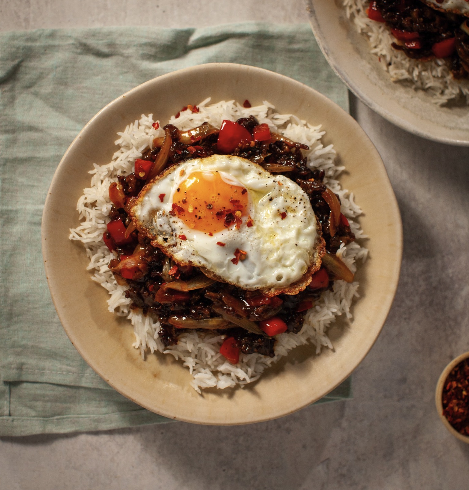 Mongolian stir-fried beef mince with fried egg and steamed rice
